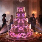 Neon botanical ornament bands in purple and cyan on tiered wedding cake — video mapping loop