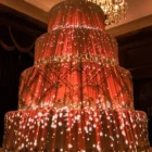 Heart particle field cascading across wedding cake tiers — Full HD projection mapping loop